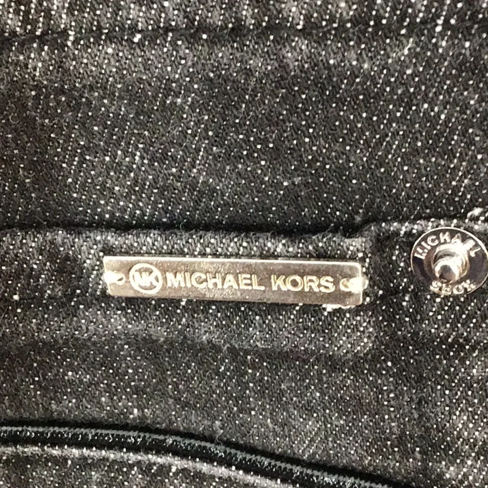 Michael Kors black bootcut jeans + MMK top